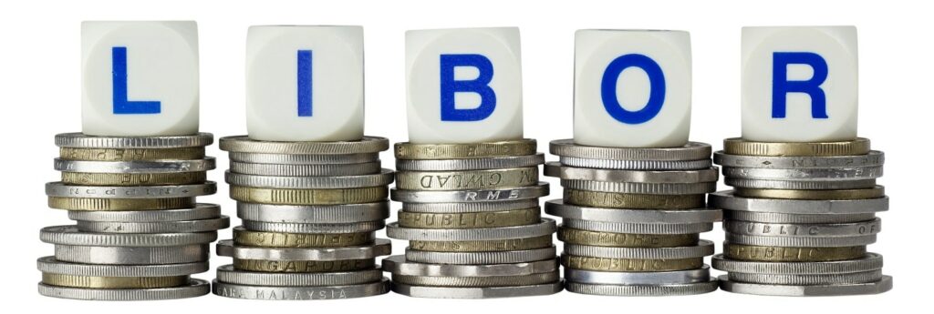 Stacks of coins with the letters LIBOR isolated on white background