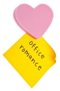 Image of heart and post it note saying Office Romance
