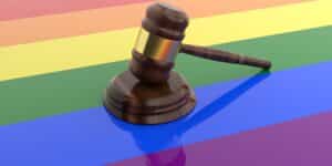 3d rendering of a gavel on a pride flag