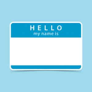 Blue blank name tag sticker HELLO my name is. Rounded rectangular badge with gray drop shadow on color background. 